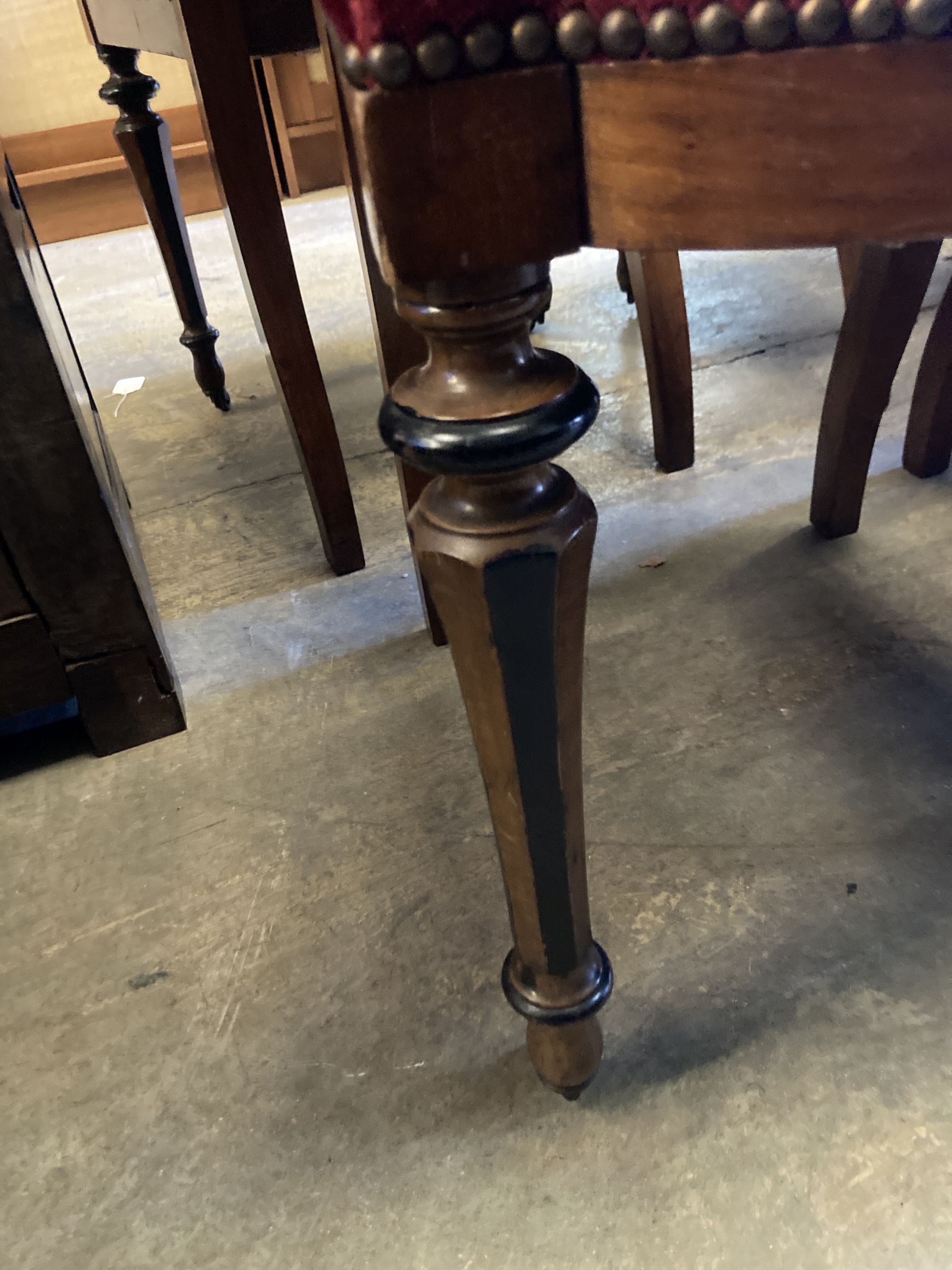 A set of twelve 19th century Continental walnut part ebonised carved walnut dining chairs